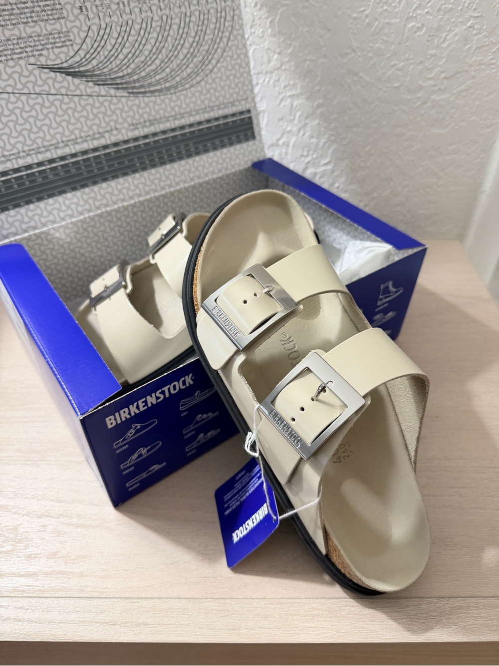 Birkenstock Women's Arizona Sandals in Cream with Silver Buckles
